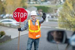construction worker holding stop sign